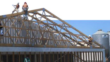 Construction work on a sow facility. Retrofitting an existing structure with a bank of air filter panels for a tunnel ventilated system. Picture courtesy by Perry Hartmann