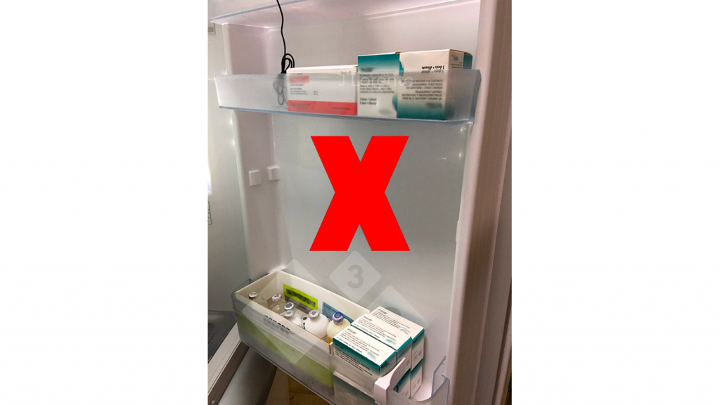 Vaccines in the refrigerator door.